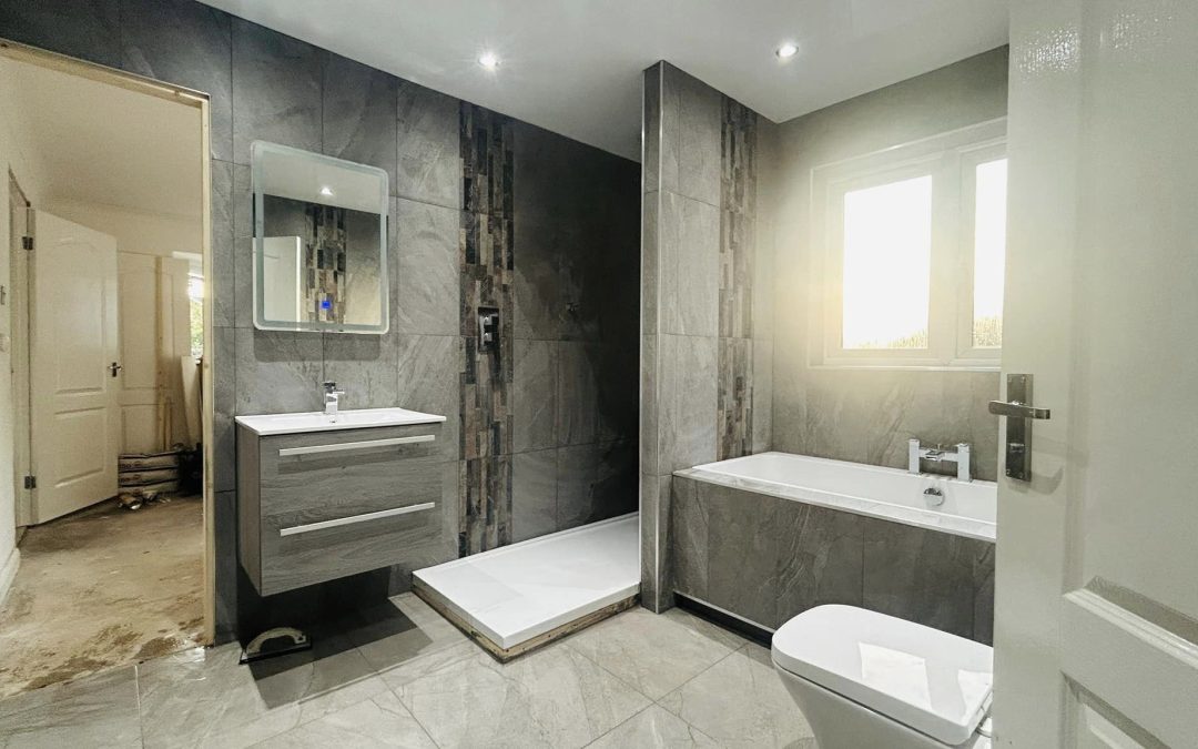 Bathrooms - Grey slate bathroom with walk-in shower and bathtub