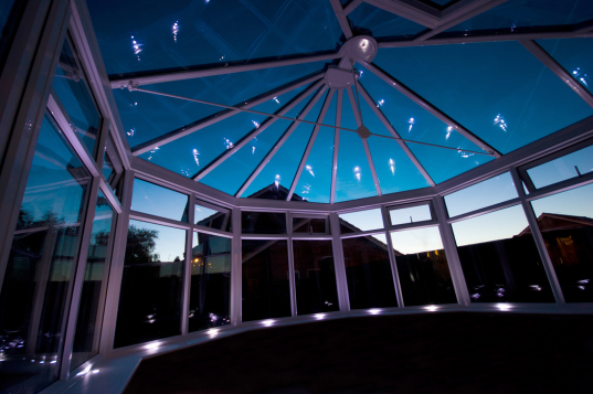 A conservatory at night with led lights