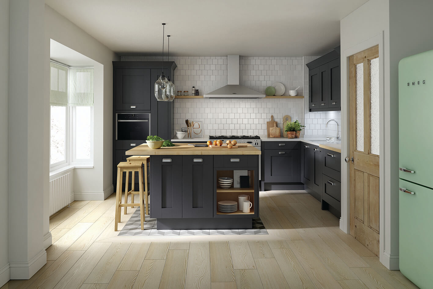 a kitchen with black cupboards and an island