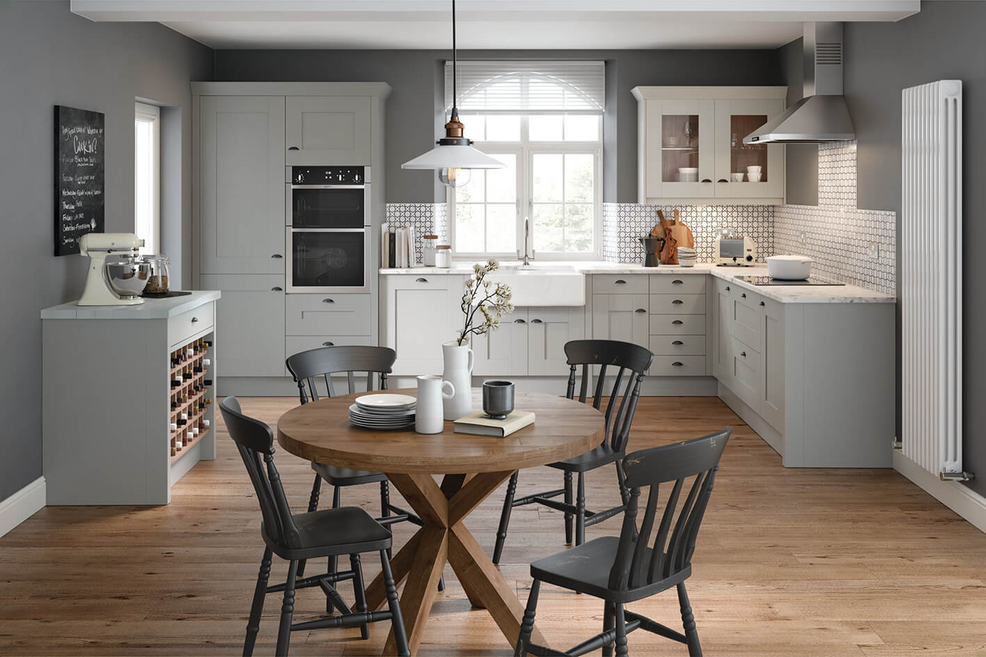 a white kitchen with a small circular breakfast table